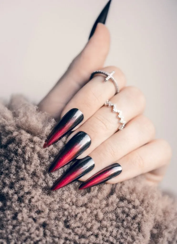 Red black stiletto ombre winter nails.