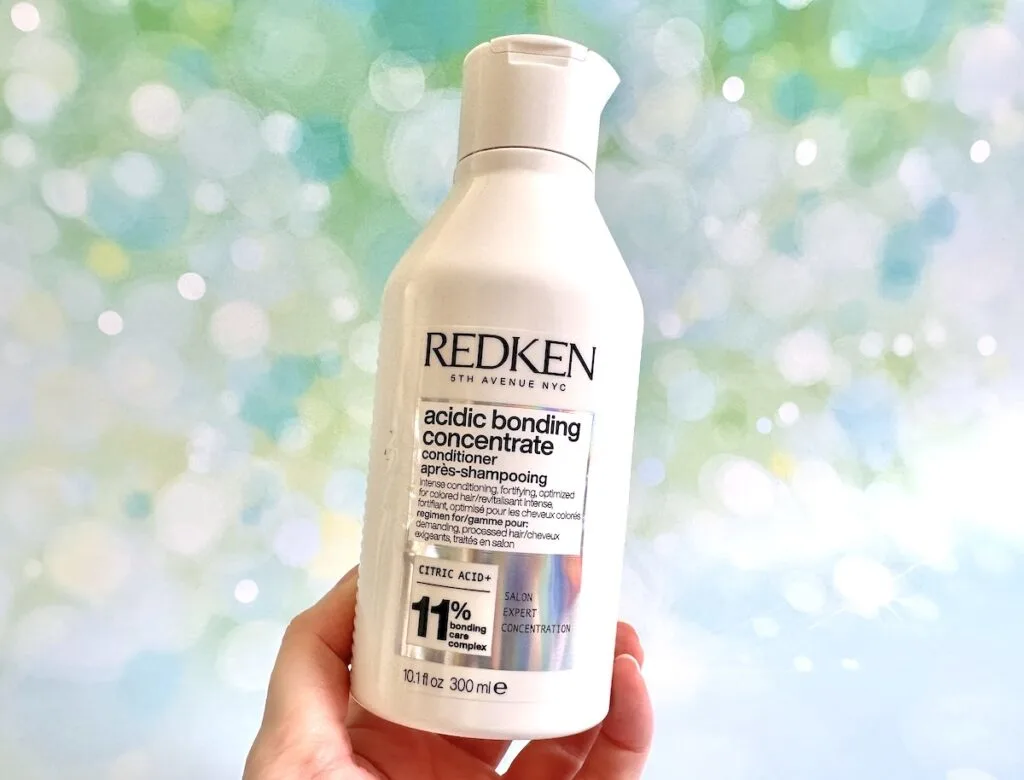 Redken Acidic Bonding Concentrate Conditioner, handheld.