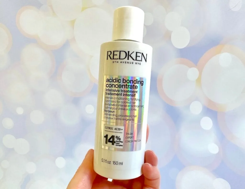 Redken Acidic Bonding Concentrate Intensive Treatment, handheld.