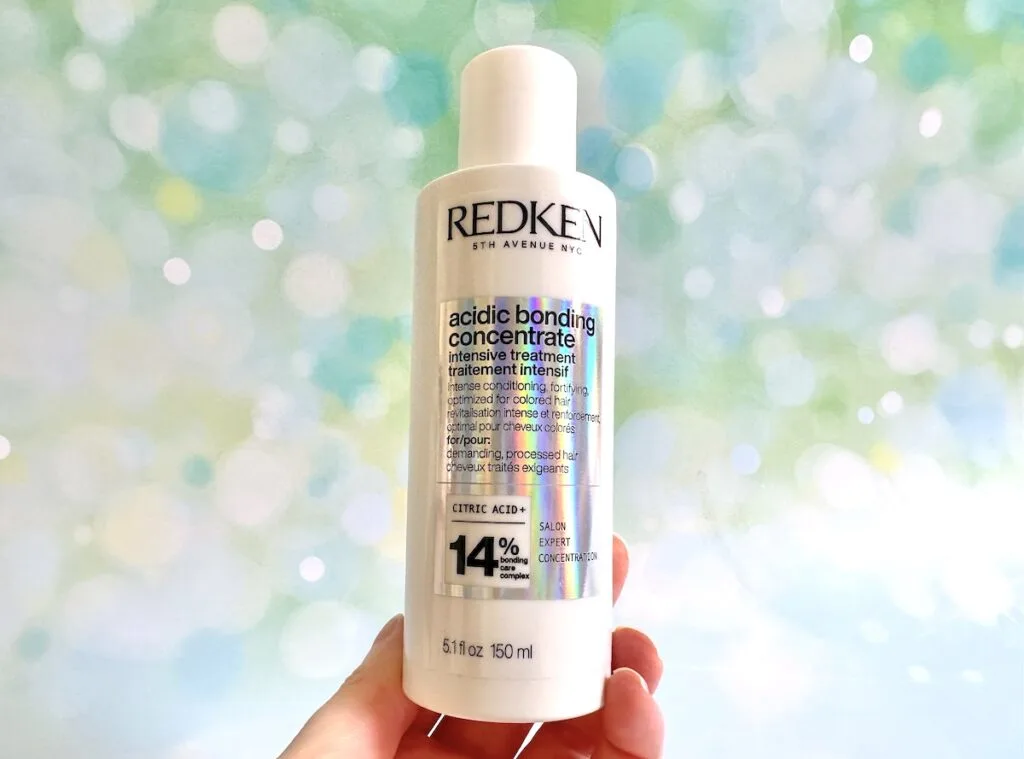 Redken Acidic Bonding Concentrate Intensive Treatment, handheld.