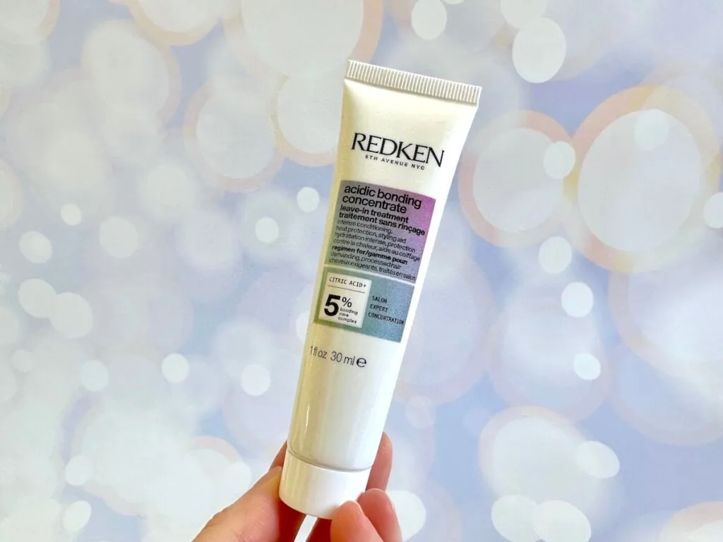 Redken Acidic Bonding Concentrate Leave-in Treatment, handheld.