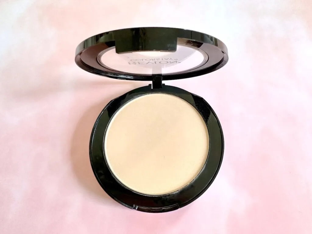 Revlon Colorstay Powder in the shade Light Medium. Open compact flatlay.