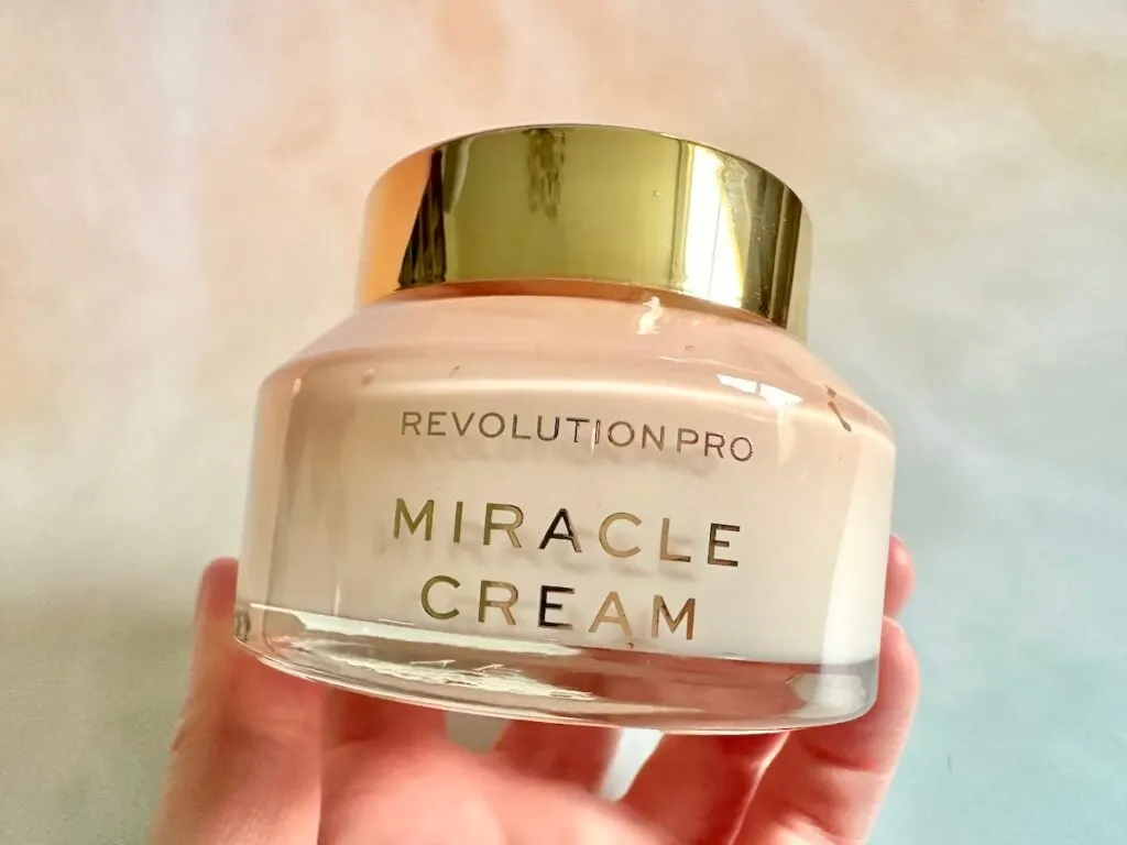 Revolution Pro Miracle Cream, handheld.