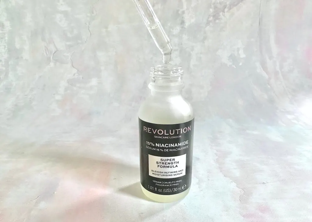 Revolution Skincare 15% Niacinamide Serum, open bottle with dropper appliacator.