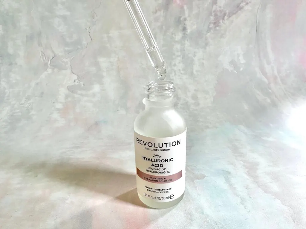 Skincare Revolution 2% Hyaluronic Acid Plumping and Hydrating Serum, open bottle with dropper.