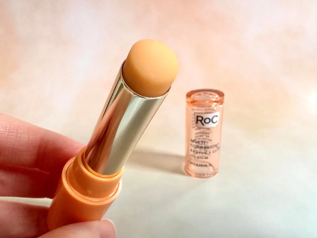 RoC Multi Correxion Revive + Glow Eye Balm, handheld, lid removed.