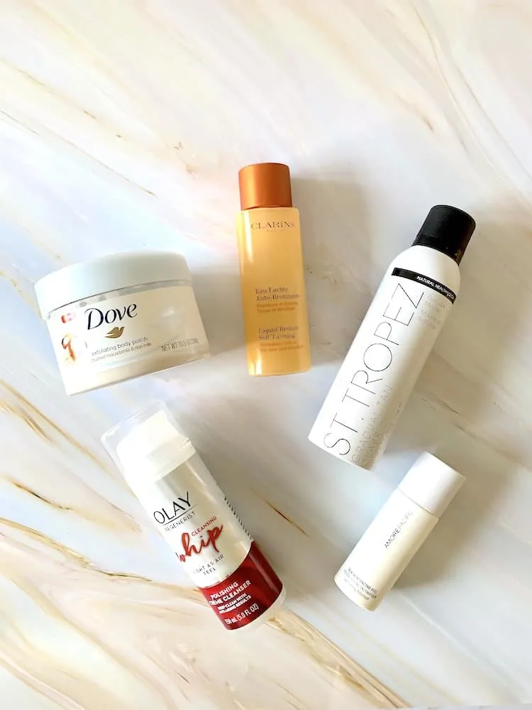 Self Tanning Products - Clarins Liquid Bronze, St Tropez Gradual Tan Classic Mousse, Dove Body Polish, Olay Whip Polishing Cleanser, Amore Pacific Treatment Enzyme Peel