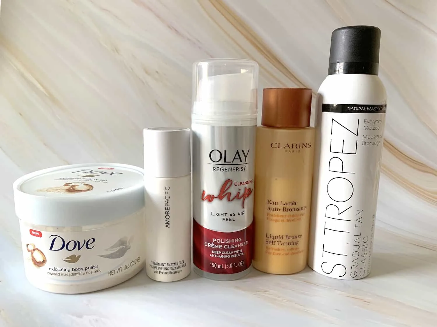 Self Tanning Products - Clarins Liquid Bronze, St Tropez Gradual Tan Classic Mousse, Dove Body Polish, Loreal Sublim Bronze Self Tanning Towelettes, Olay Whip Polishing Cleanser, Amore Pacific Treatment Enzyme Peel