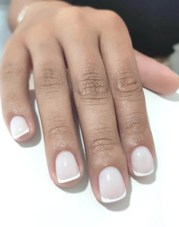 Short French tip nails.