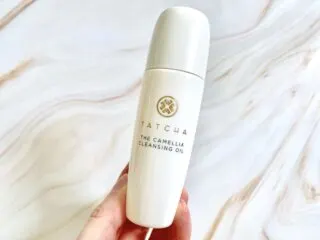 Tatcha The Camellia Cleansing Oil handheld.