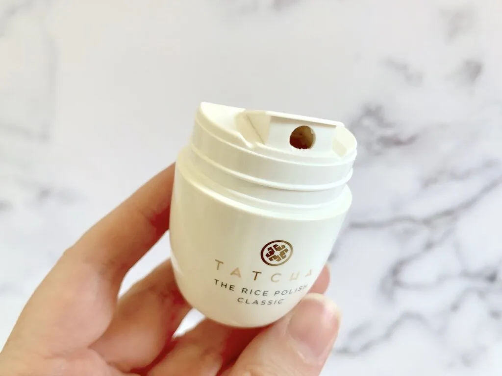 Tatcha The Rice Polish handheld and open.