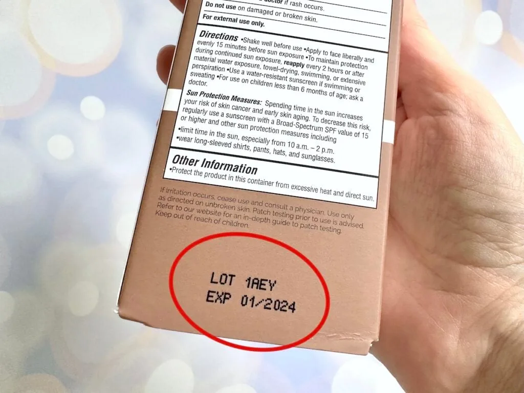 The Ordinary Mineral UV Filters SPF 30 with Antioxidants, handheld with expiration date circled in red.