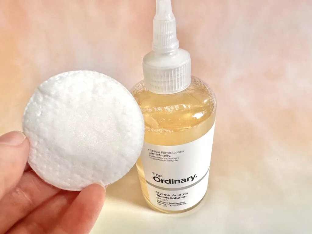 How To Use The Ordinary Glycolic Acid 7% Toning Solution bottle behind sample on cotton pad.