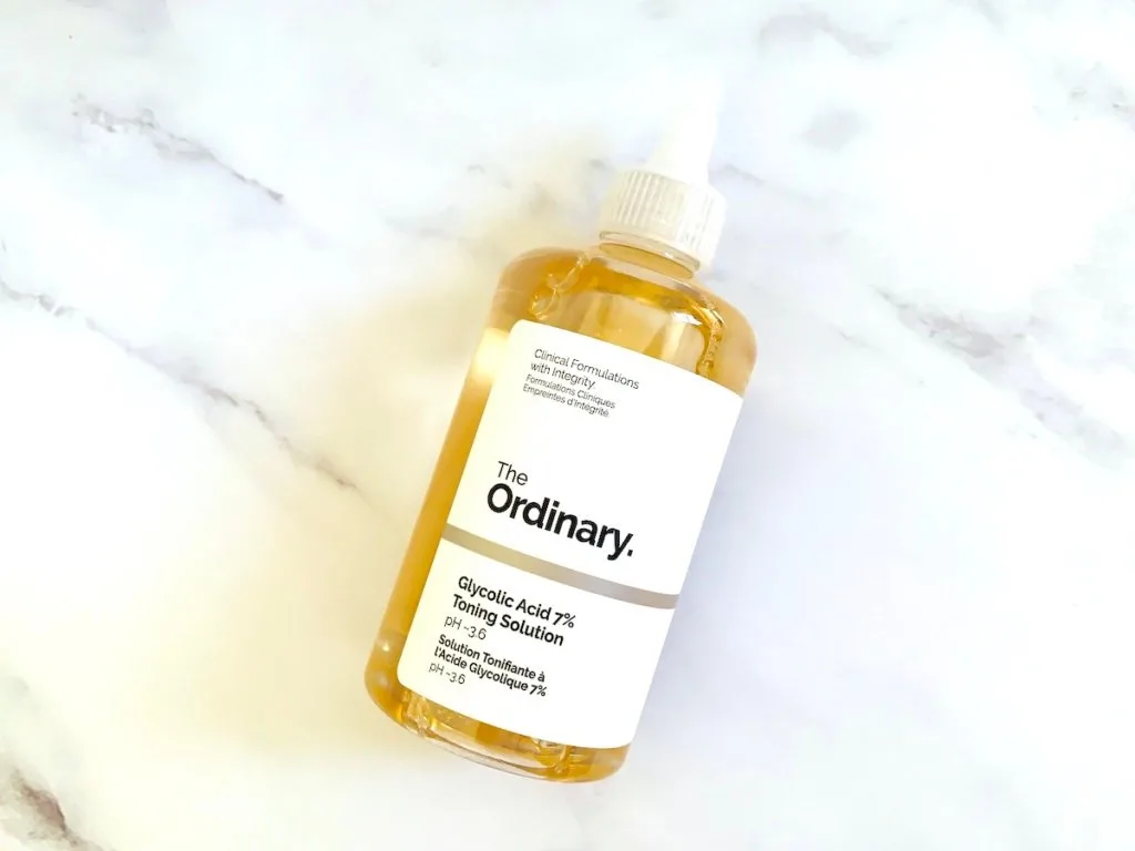 The Ordinary Glycolic Acid 7% Toning Solution flatlay on white marble background