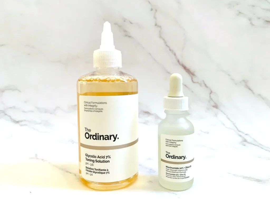 The Ordinary Glycolic Acid 7% Toning Solution and The Ordinary Niacinamide 10% + Zinc 1% on marble background