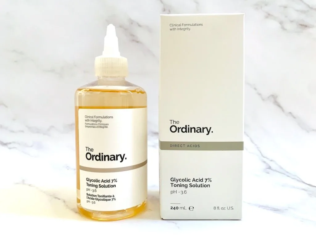 The Ordinary Glycolic Acid 7% Toning Solution and box on white marble background