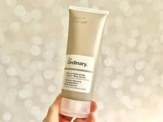 The Ordinary Natural Moisturizing Factors + Beta-Glucan, handheld.