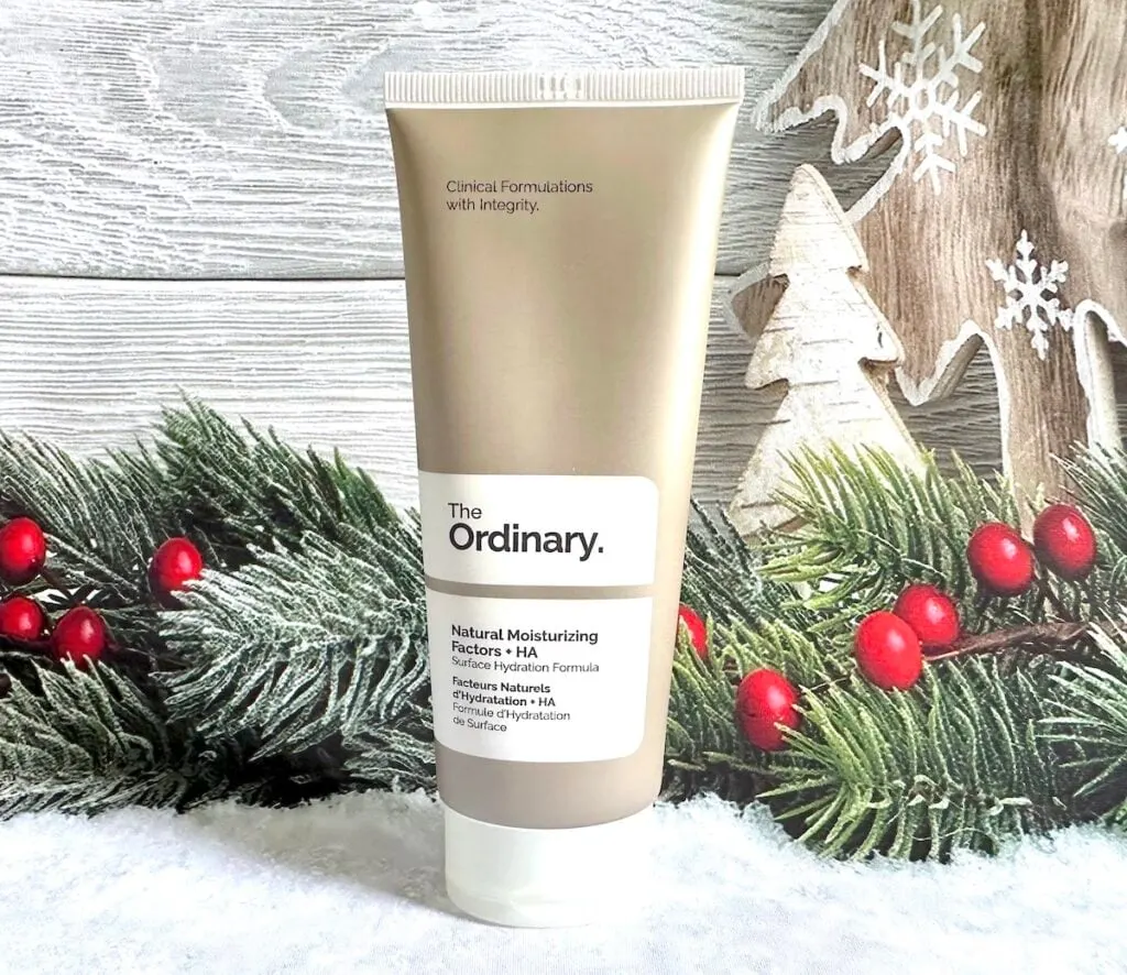 The Ordinary Natural Moisturizing Factors + HA in front of Christmas holly.