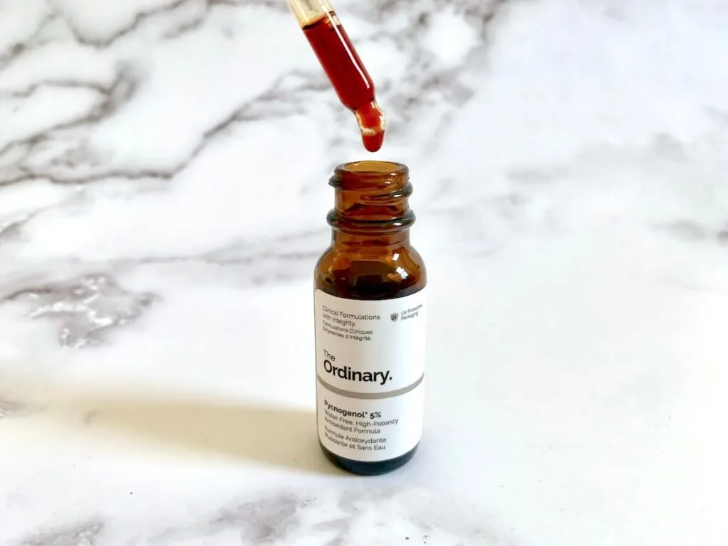 The Ordinary Pycnogenol 5% antioxidant serum open with dropper showing red color.