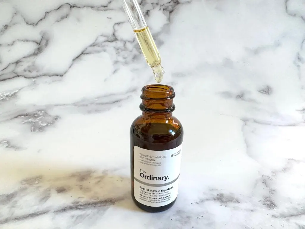 The Ordinary Retinol 0.2% in Squalane, open with dropper.