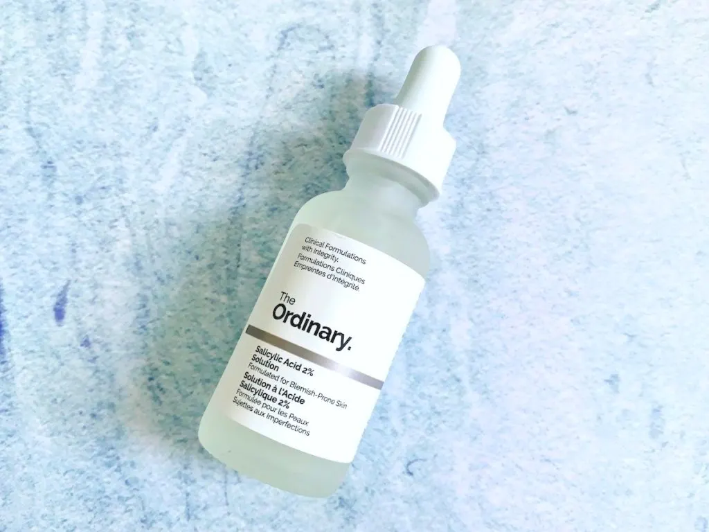 The Ordinary Salicylic Acid 2% Solution (Reformulated) flatlay on blue background