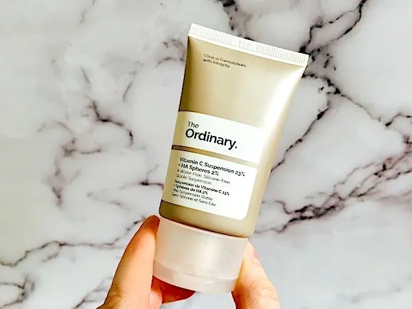 The Ordinary Vitamin C Suspension 23% + HA Spheres 2% on marble background