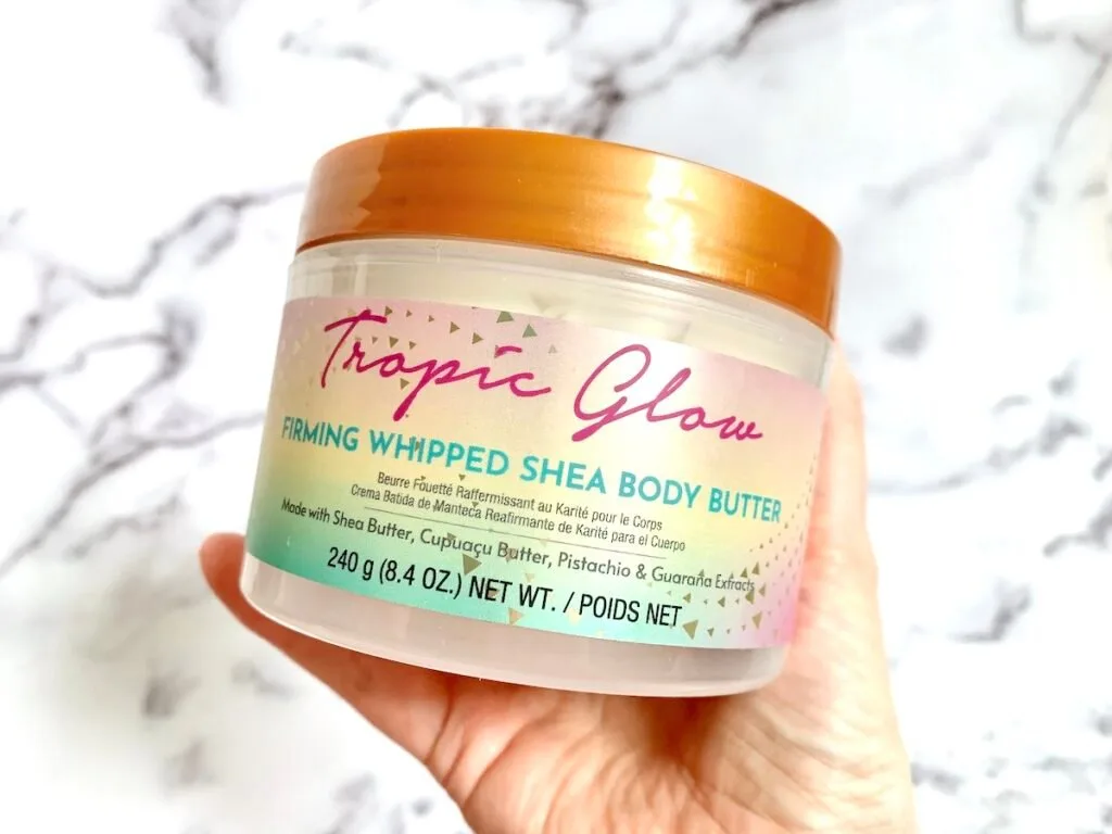 Tree Hut Tropic Glow Firming Whipped Shea Body Butter handheld.