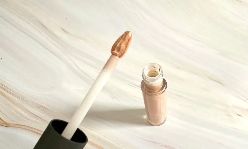 Ulta Beauty Full Coverage Liquid Concealer in the shade Light Cool, open tube with triangular applicator wand.