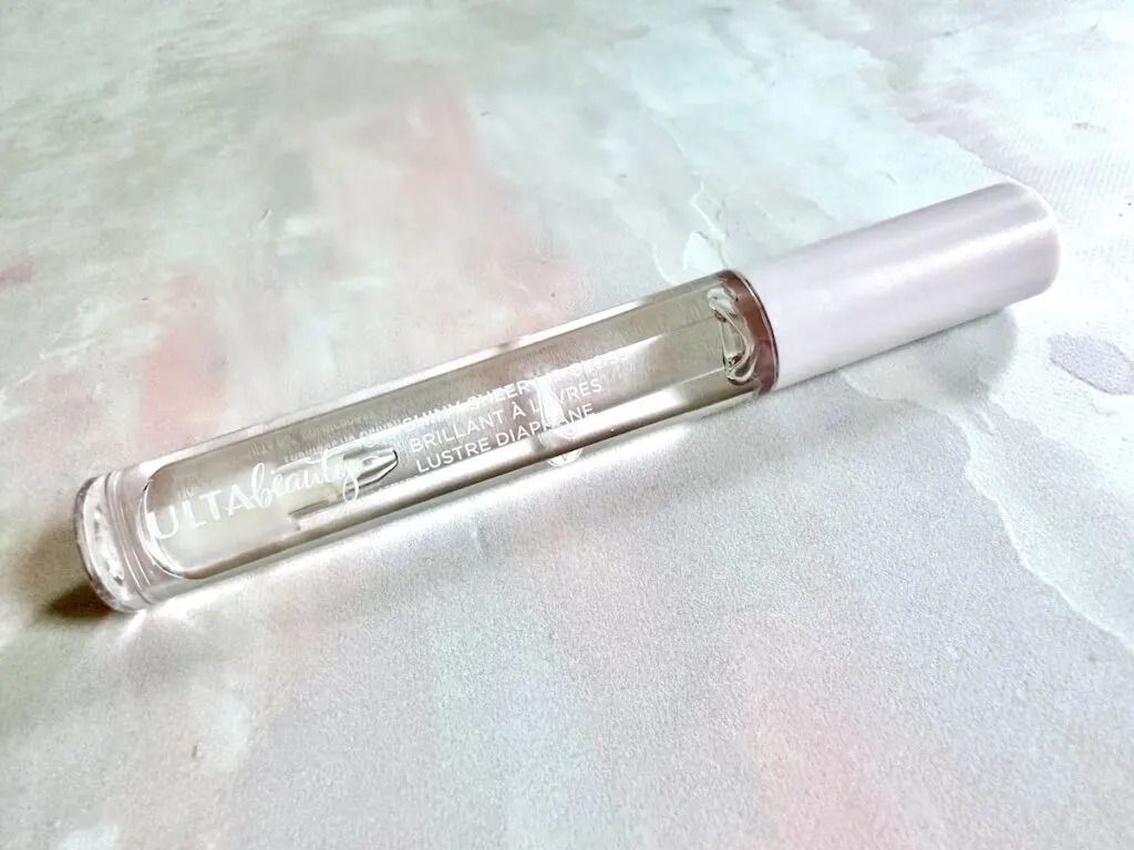 Ulta Beauty Shiny Sheer Lip Gloss in the shade Ice, flatlay.