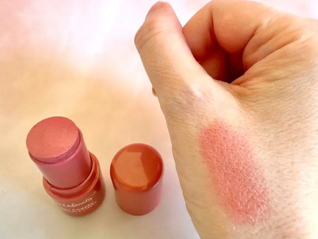 Ulta Beauty Too Cheeky Lip & Cheek Color Stick in the shade Charmed, lid removed next to sample on hand.