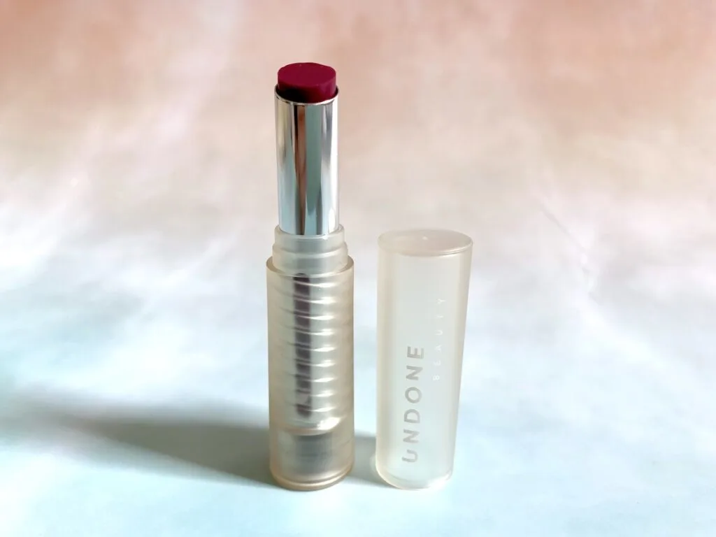 Undone Beauty Matte Talk lipcolor opened in the shade Raspberry.