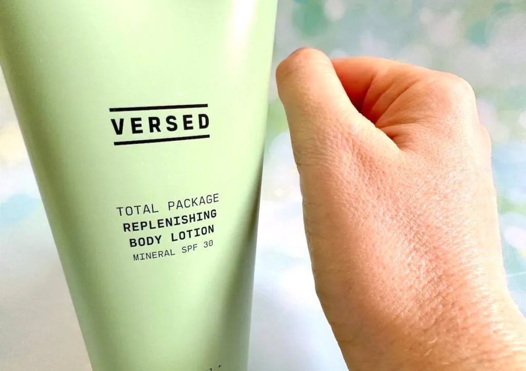 Versed Total Package Replenishing Body Lotion Mineral SPF 30, tube next to sample on hand, absorbed.