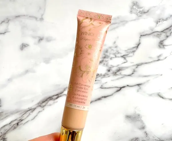 Winky Lux Peeper Perfect Full-Coverage Under-Eye Concealer, handheld.