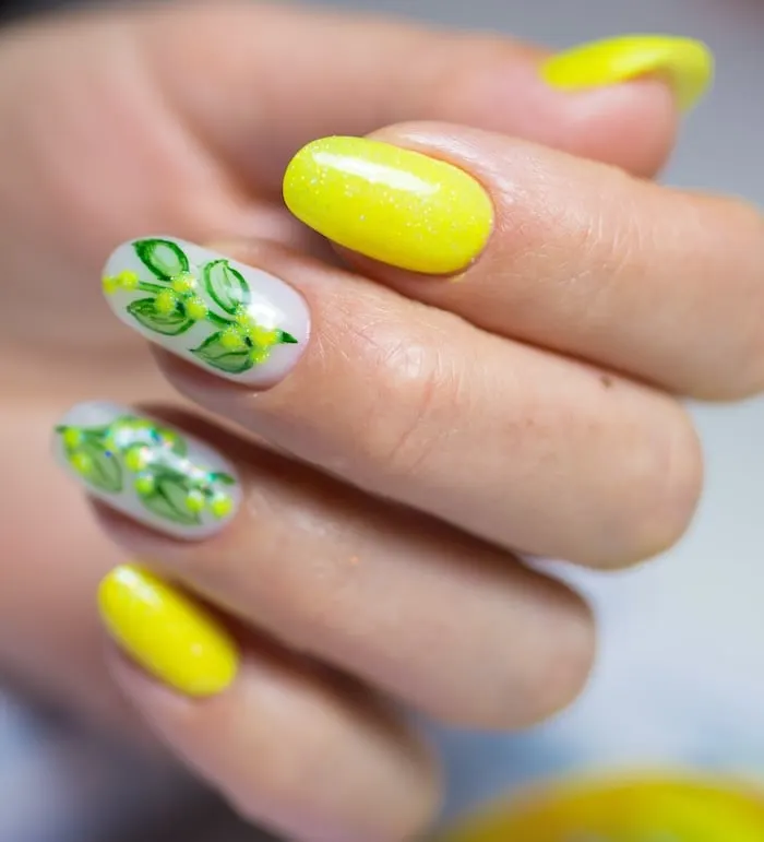 Yellow nails with green leaves.